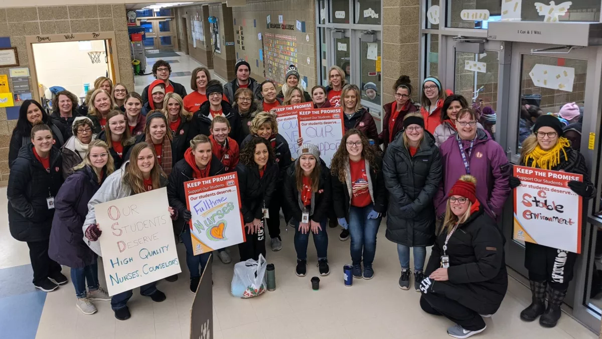 educators with advocacy signs