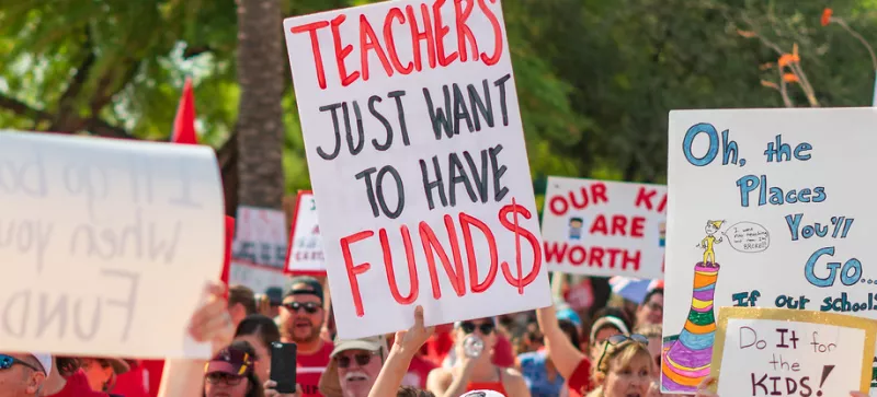 Rally with the sign "teachers just want to have funds."