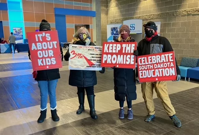 members holding signs