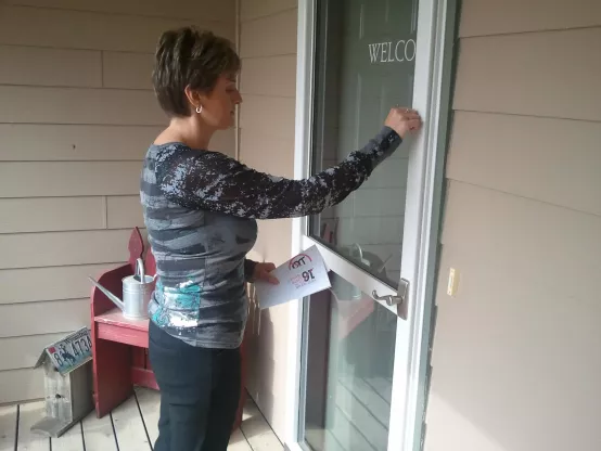 member knocking on door