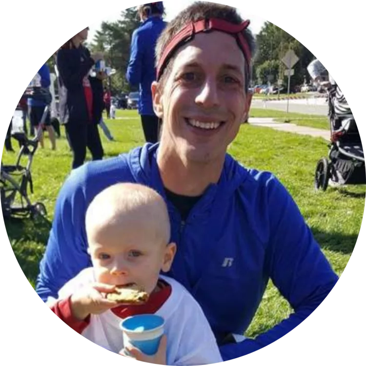 Kerry Konda poses for a picture with their child.